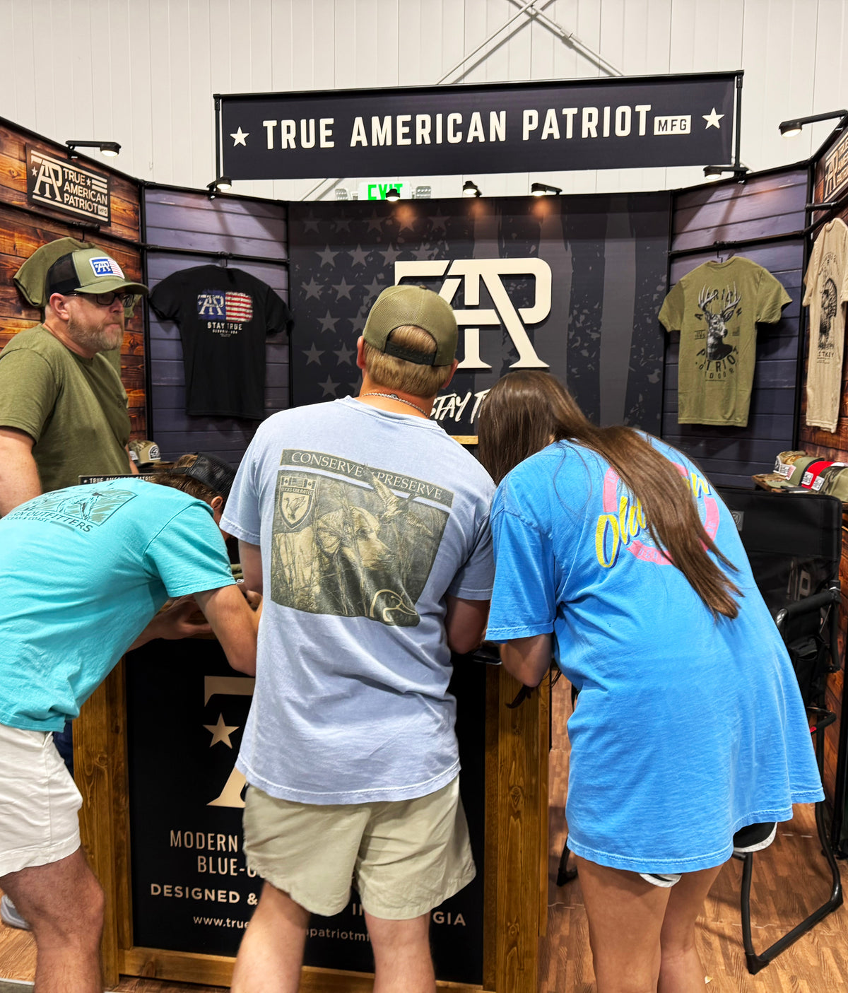 Buckarama attendees visiting the True American Patriot MFG booth in Georgia