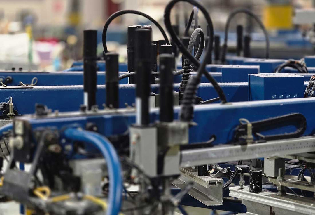 Automatic screen printing press used to produce True American Patriot apparel in Georgia.