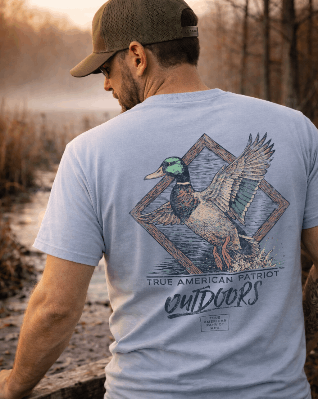 Man Wearing True American Patriot Mfg - Mallard in Flight Outdoors next to Marsh