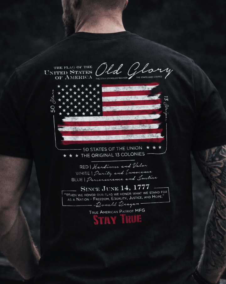 Man wearing a True American Patriot Mfg Old Glory Black Tshirt showing the back design 