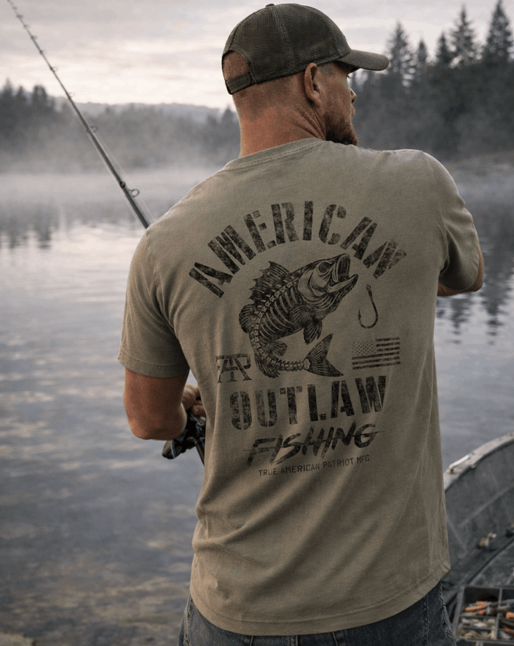 Man fishing while wearing a True American Patriot American Outlaw Fishing Tee