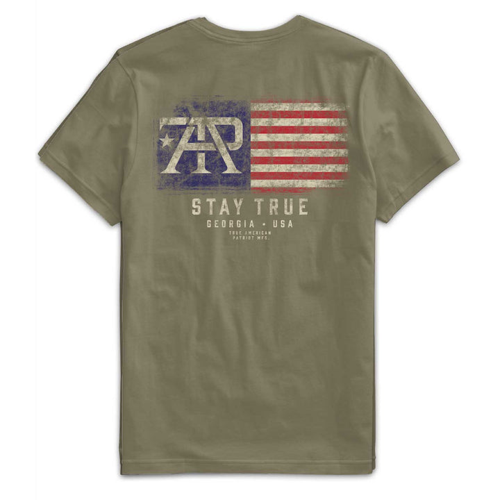 Back of Stay True Flag Tee in Military Green featuring large distressed TAP American flag graphic with "Stay True" artwork by True American Patriot MFG.
