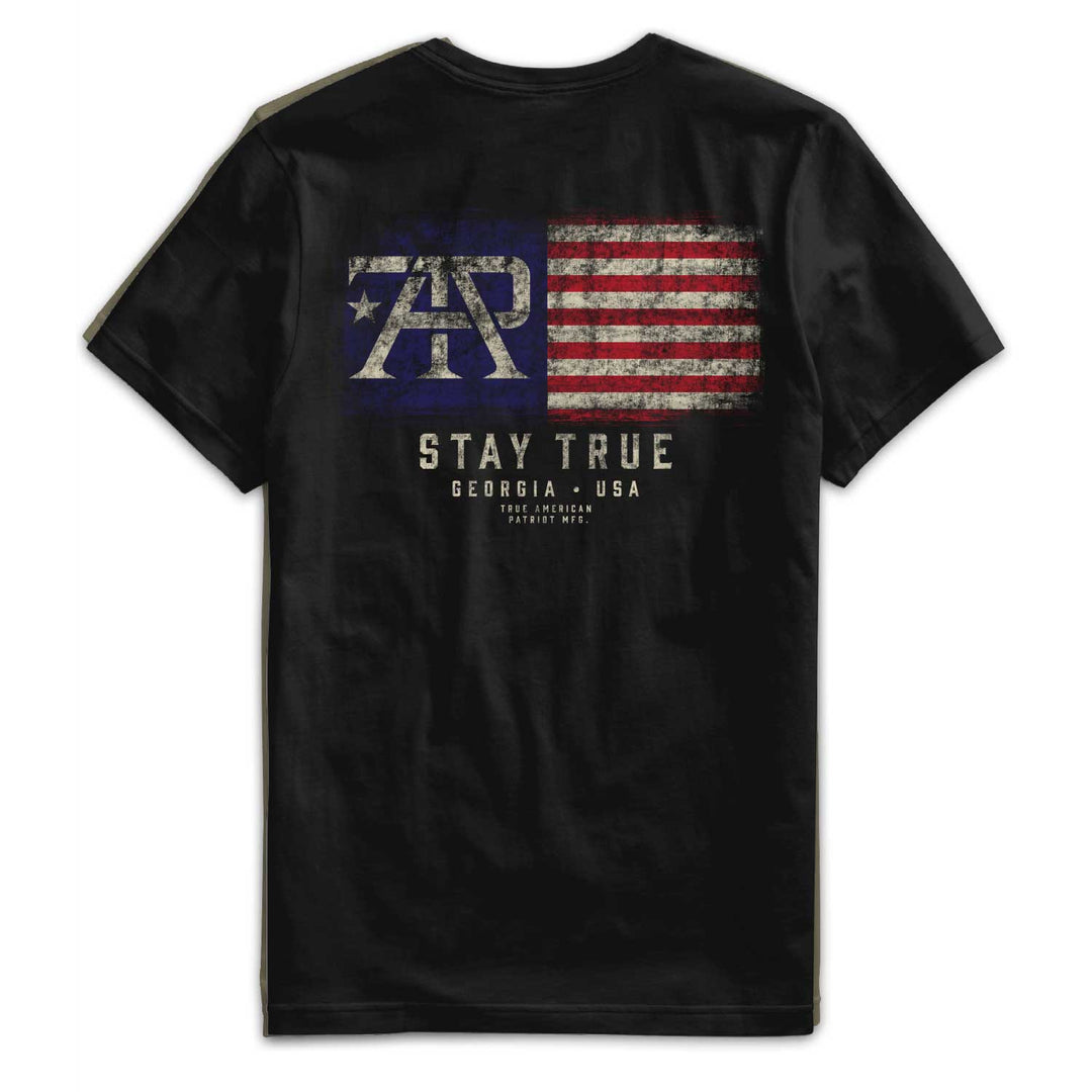 Back of Stay True Flag Tee in Black featuring large distressed TAP American flag graphic with "Stay True" artwork by True American Patriot MFG.