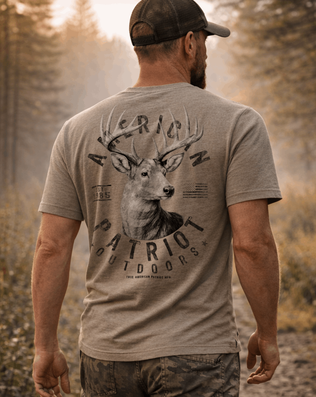 Man wearing a True American Patriot Mfg Whitetail Buck American Outdoors Tee walking through the woods