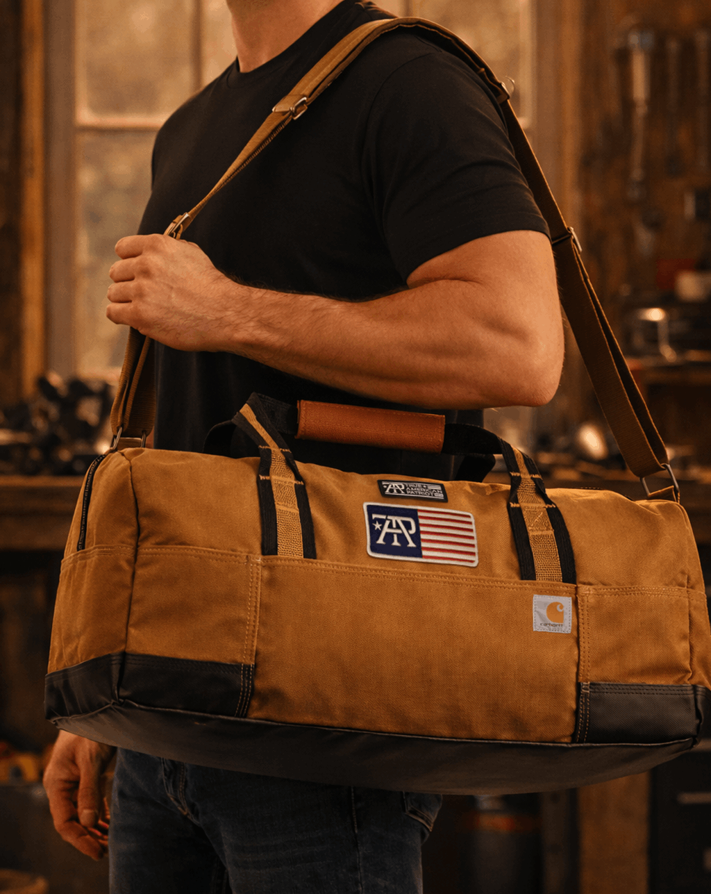 Man carrying a True American Patriot Mfg. Brown × Carhartt 20" Heavy-Duty Duffel
