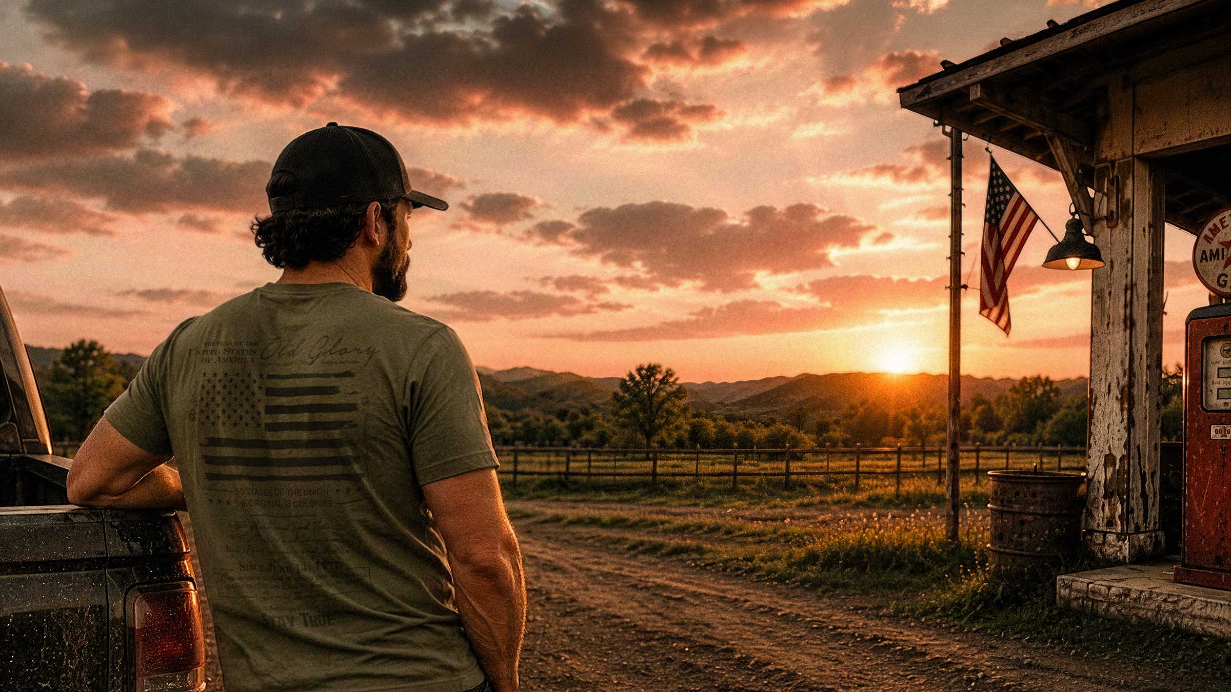 Blue-collar lifestyle apparel by True American Patriot MFG featuring a man overlooking a rural American sunset